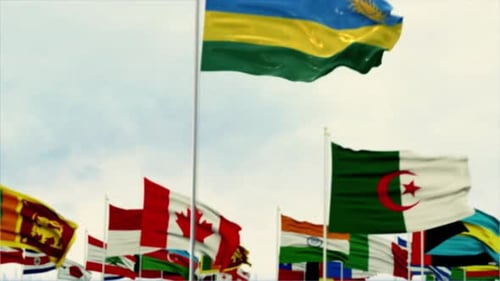 Waving Flag of Rwanda with Blurred World Flags