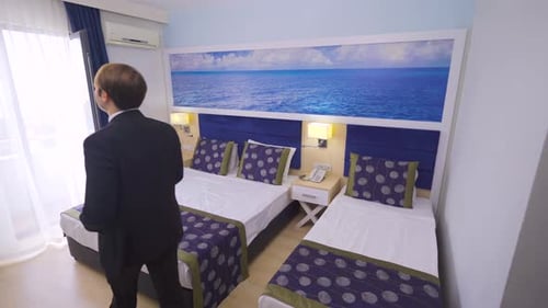 Businessman entering hotel room.