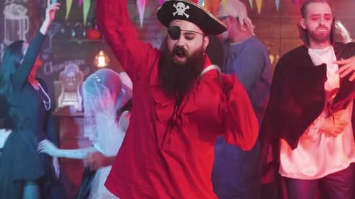 Halloween Party with Costumed People Dancing
