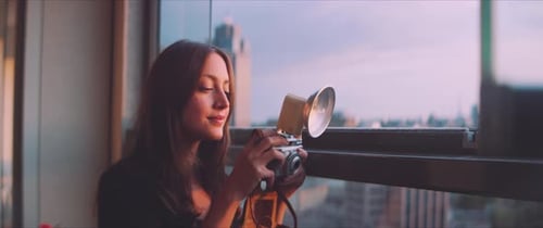 Young Woman Taking City Photos With Vintage Camera