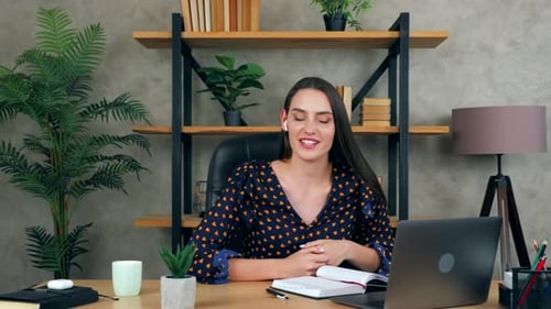 Smiling emotional woman in home office tells teacher remote video conference call webcam laptop