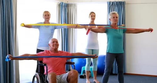 People Exercising with Resistance Bands Indoors