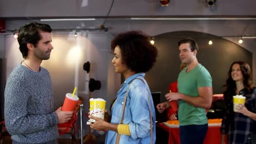 Friends Chatting with Refreshments at Indoor Event
