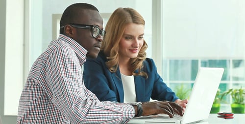 Teamwork Using Laptop in Bright Office Environment