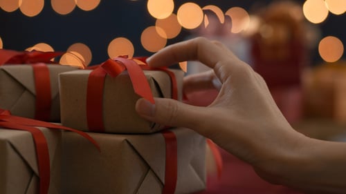 Christmas Presents Stacked with Lights at Night