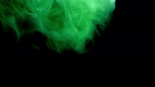 Colorful Green Ink Drops From Above Mixing in Water Swirling Softly Underwater on Black Background
