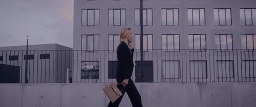 Business Woman Walking and Talking on Phone