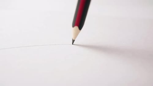 Pencil Writes Thin Line on White Paper