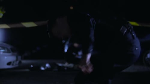 Crime Scene Investigation at Night with Police Cars