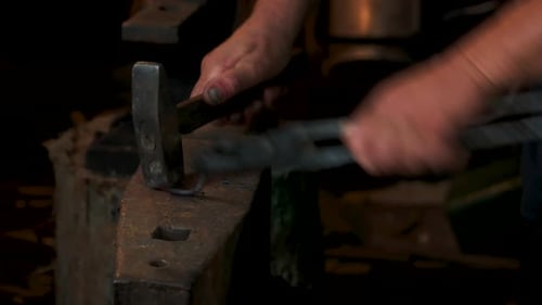 Metal Shaping on Anvil with Hammer and Tongs