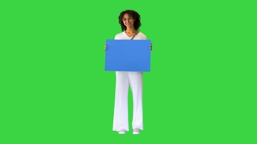 African American Woman Holding a Blank Blue Sign on a Green Screen Chroma Key
