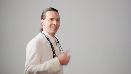 Smiling Doctor Gives Thumbs Up Approval