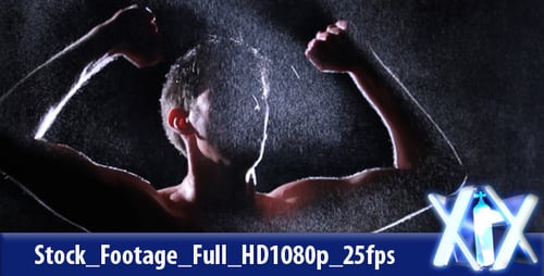 Man Showers with Rain while Flexing Muscles in Dark