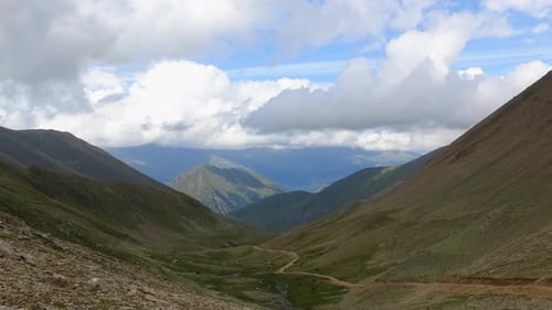 Timelapse in valley with beautiful clouds moving fast in national park of Dombay