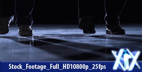 Dancing Legs and Feet on Reflective Floor at Night
