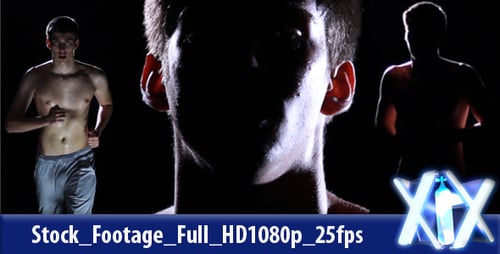 Shirtless Athlete Running in Dark Studio