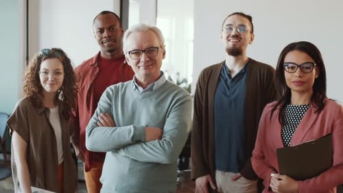 Mixed-Aged Multiethnic Business Team Posing for Camera in Office