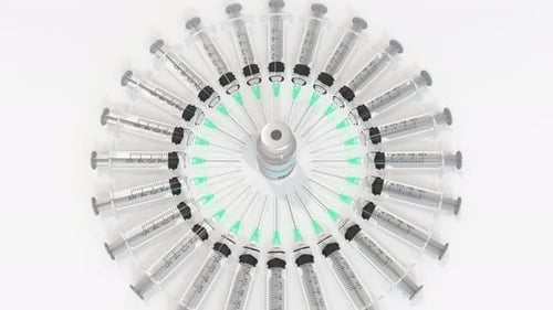3D Animation of Syringes Spinning Around Vaccine Vial Reveal