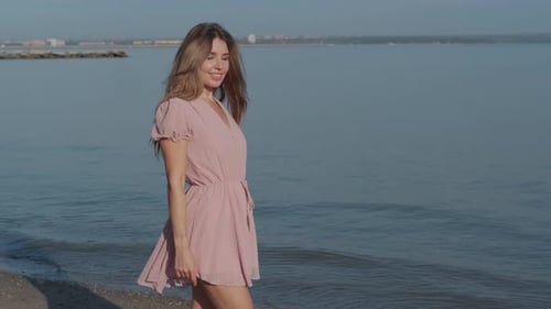 Happy Woman Twirling on a Sunny Beach