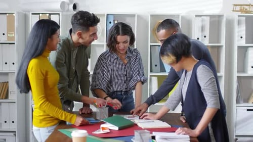 Diverse Team Collaborating on a Project in Office