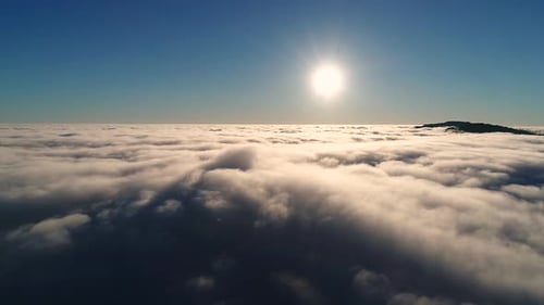 Aerial View of Clouds Under Bright Sun