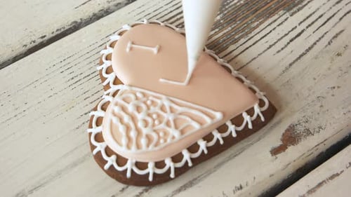 Decorating Heart Cookie with I Love You Message