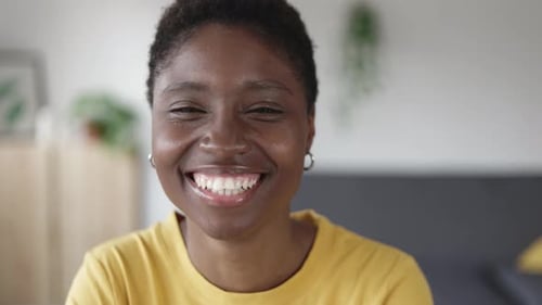 Close Up of Young Woman Smiling at Camera