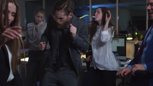 Group of Colleagues Dancing in Office