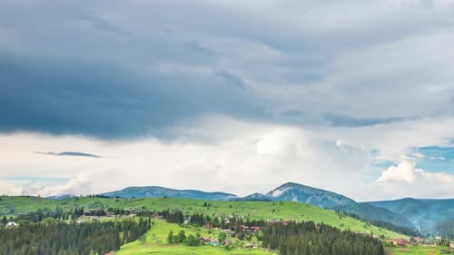 Time Lapse of Blue Sky with Clouds Over Mountain