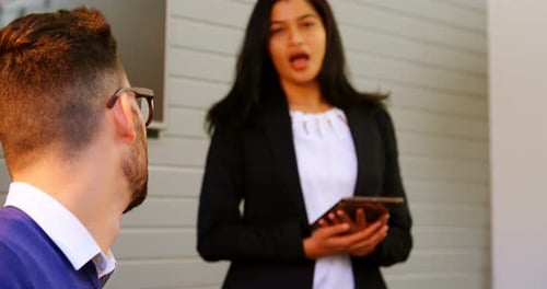 Executives discussing in conference room at office