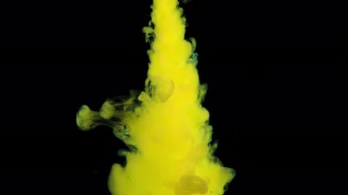 Vibrant Yellow Ink Flowing into Darkness