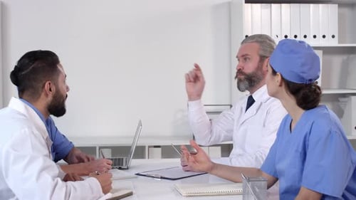 Medical Professionals in Meeting Discussing Patient Care
