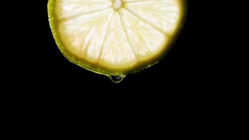 Refreshing Lime Slice with Dripping Juice Close Up