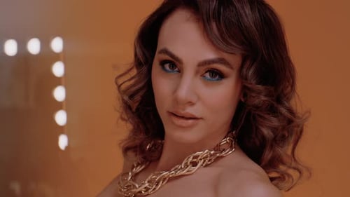 Glamorous Woman Posing with Elegant Makeup and Jewelry