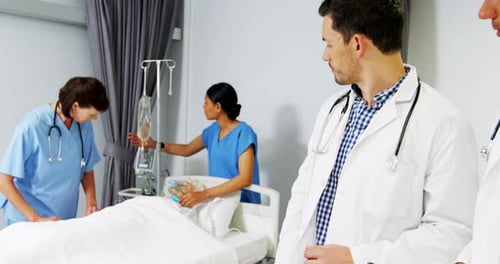 Attentive Doctors and Nurses Providing Patient Care