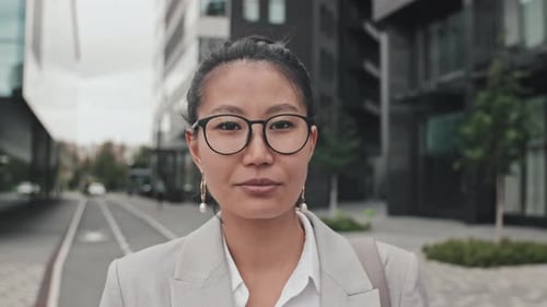 Confident Woman Standing in Urban Setting