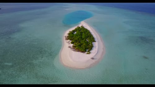 Aerial top view seascape of tropical island beach holiday by blue lagoon and bright sand background