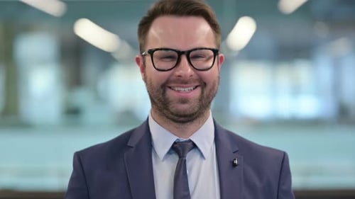 Adult Man Smiling in Office Close Up