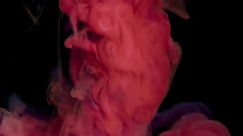 Abstract Red Ink Flowing Through Water