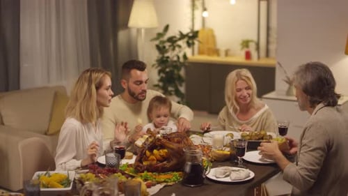 Family Shares a Meal Together at Home