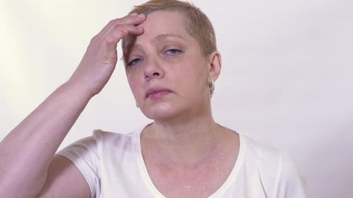 Mature Woman Checking and Looking at Her Face Condition