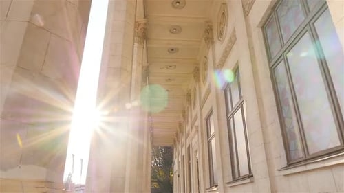 Grand Architectural Facade with Columns and Stained Glass
