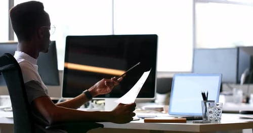 Young Adult Working in a Bright Modern Office