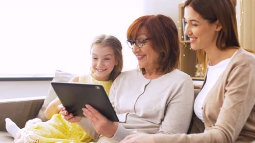Three Generations of Women Using Tablet Together