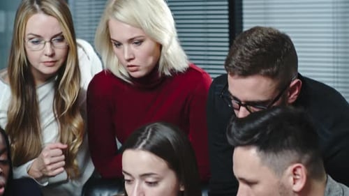 Engaged Team Discussing Business Strategy in Modern Workplace