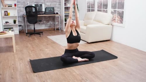 Woman Doing Yoga Poses at Home