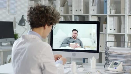 Doctor Consults Patient Online in Telemedicine Appointment
