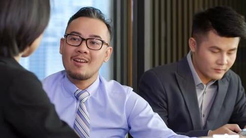 Asian Businesspeople Having Conversation