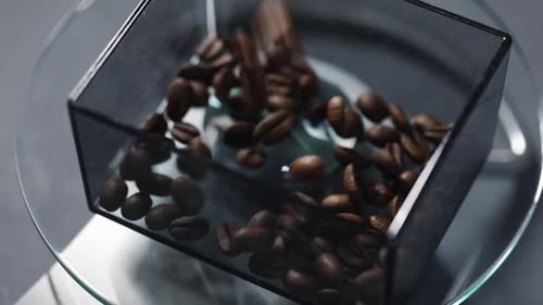 Coffee Beans Falling Into Container on Scale