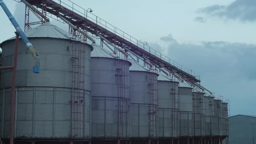 Row of Grain Silos on a Farm